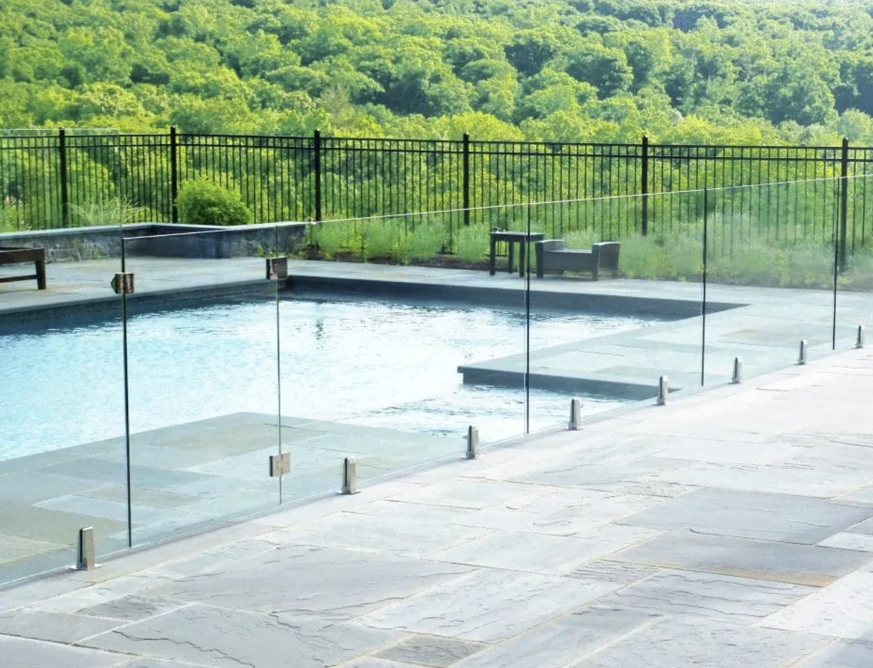 Glass fence around swimming pool