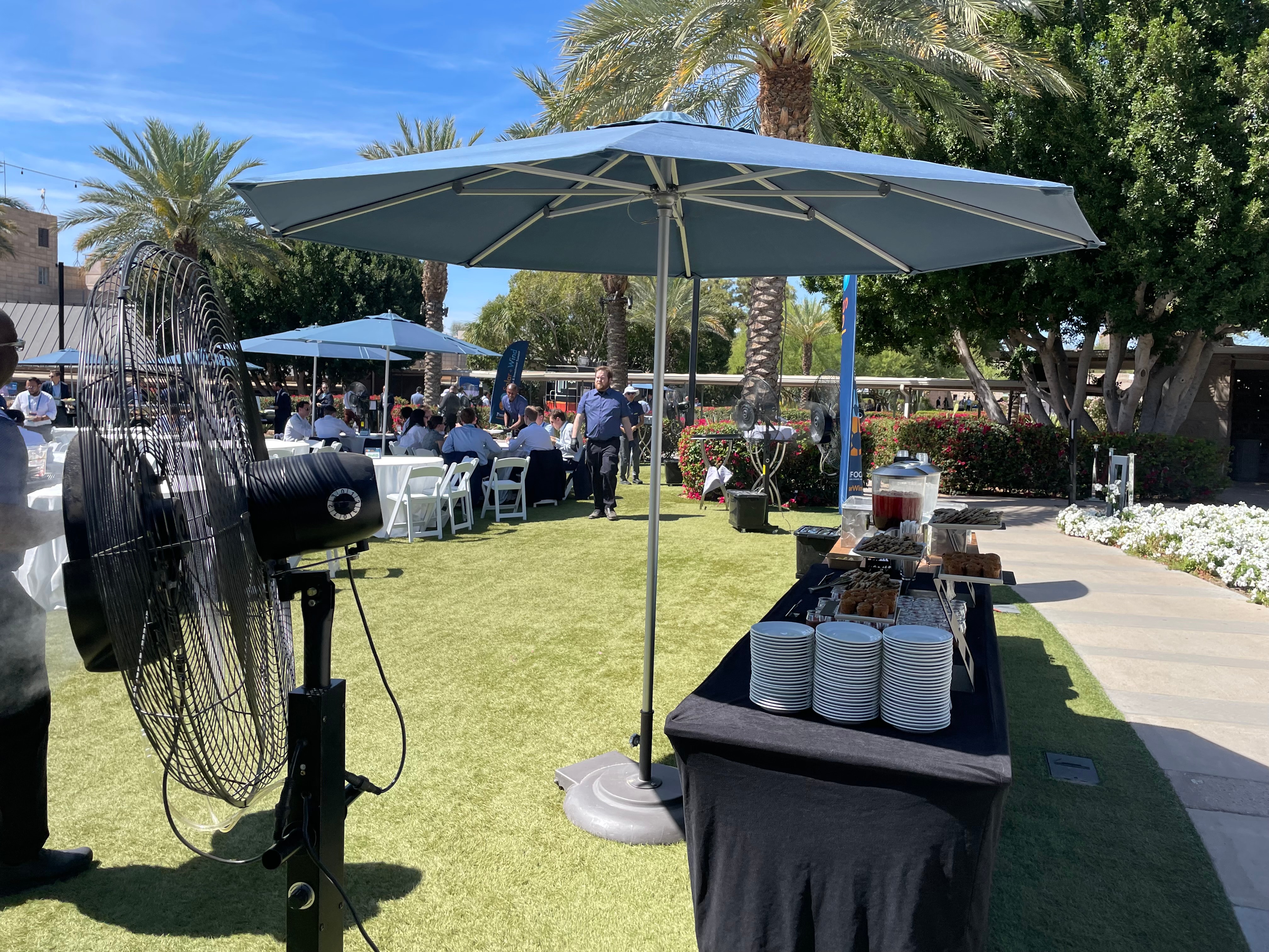 Corporate outdoor lunch event with misting fans