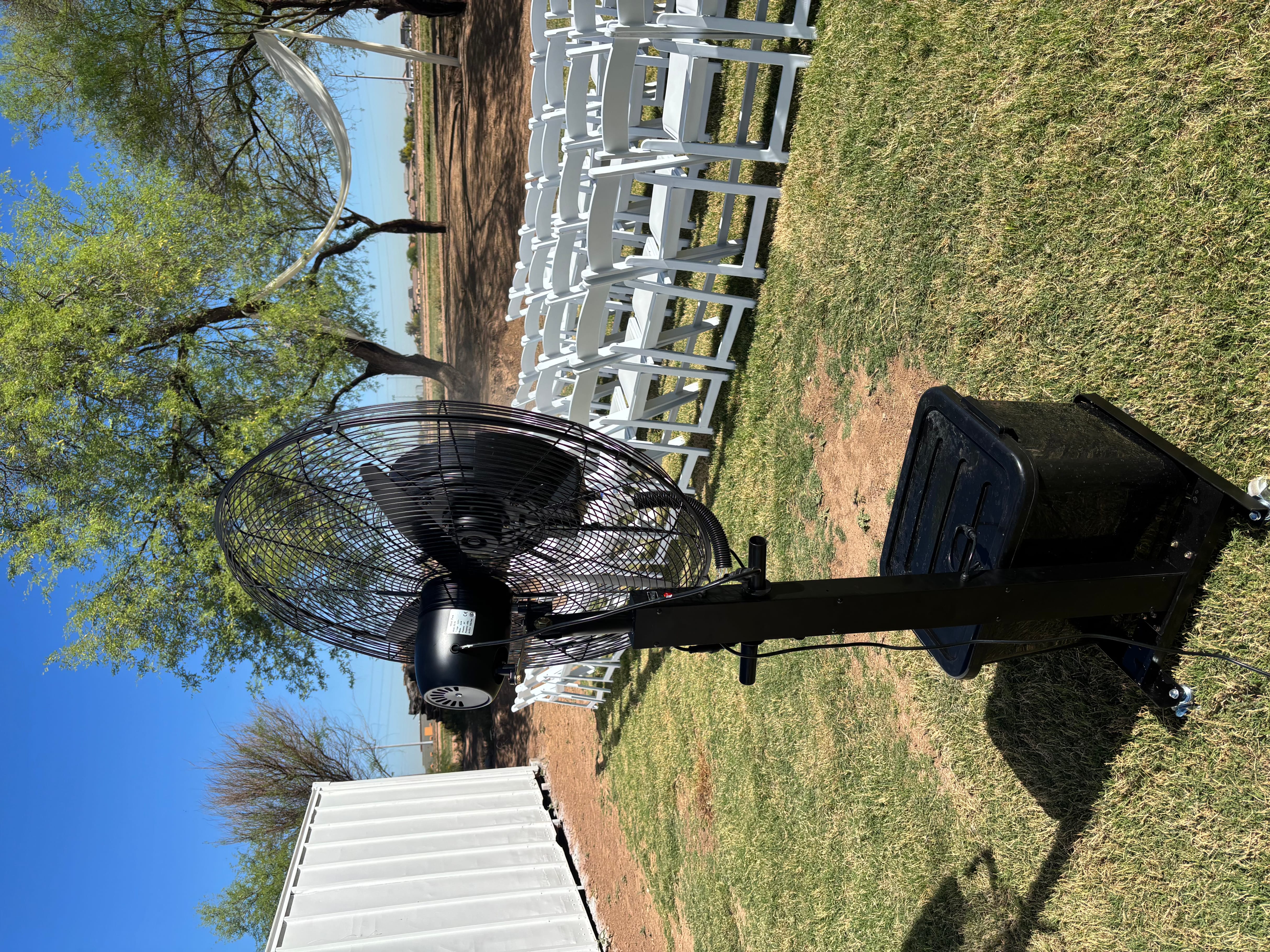 Wedding ceremony setup with misting fan