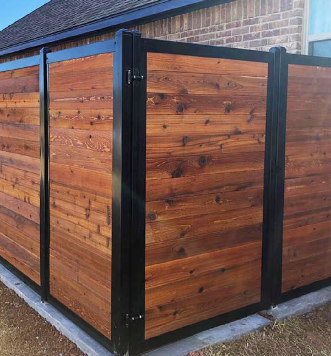 Wood privacy fence with black metal frame